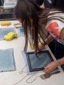 girl making feathers