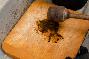 Workshop participant on 2/20 beating pulp by hand