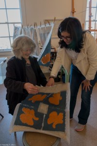Andi looking at quilt block being peeled off IMG_3577