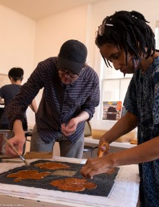 Candace and David putting on string IMG_3842