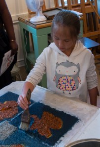girl brushing edges for quilt block IMG_3903
