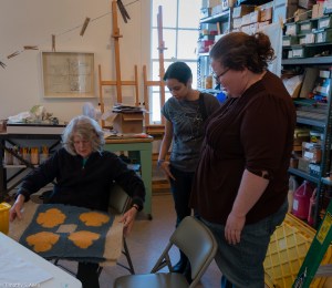 Laurel and Anna looking at quilt square IMG_3560