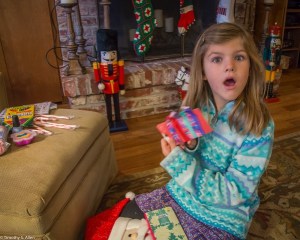 my grand daughter Sarah opening her stocking from Santa on Christmas morning.!